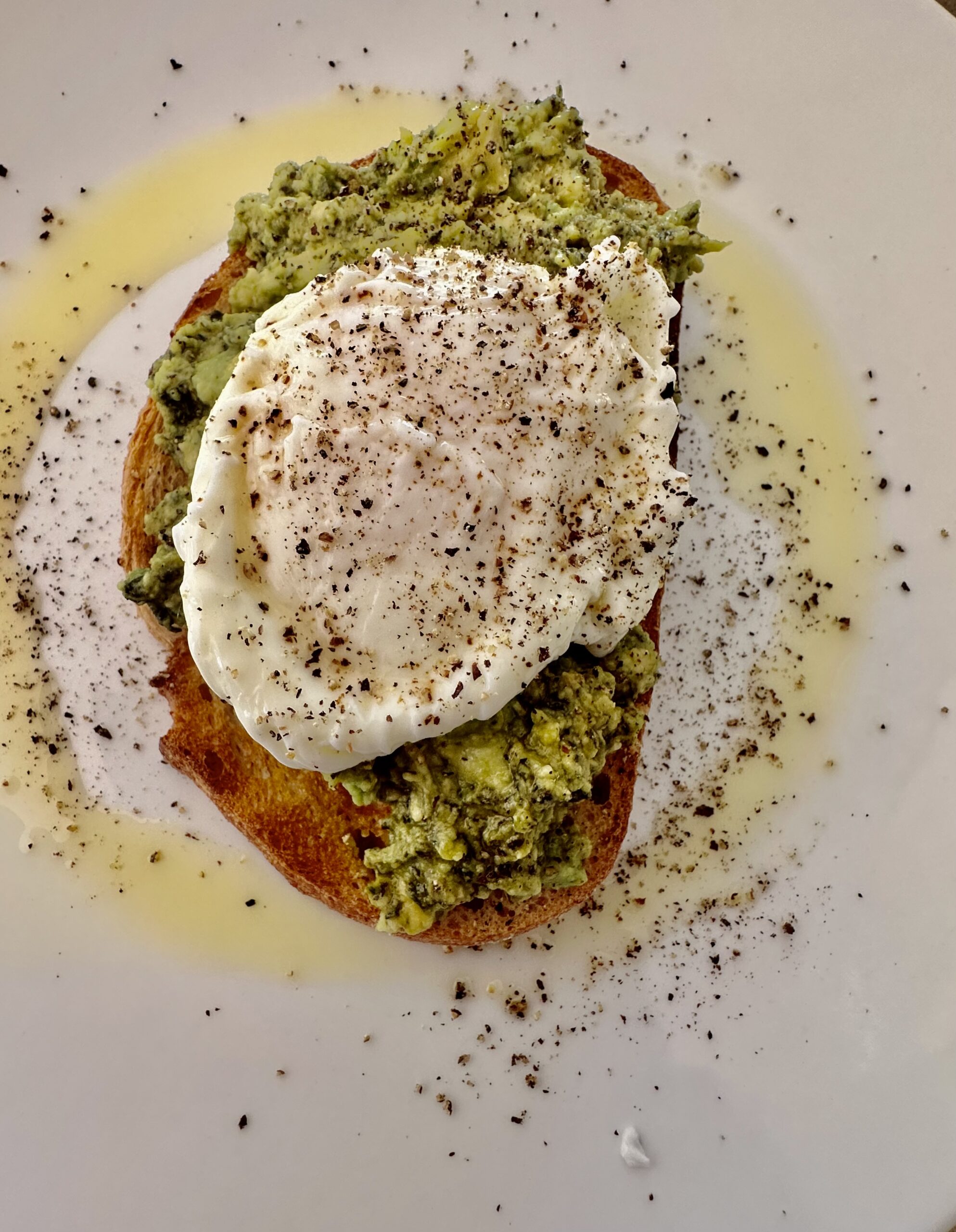 Smashed avocado and poached eggs on toast